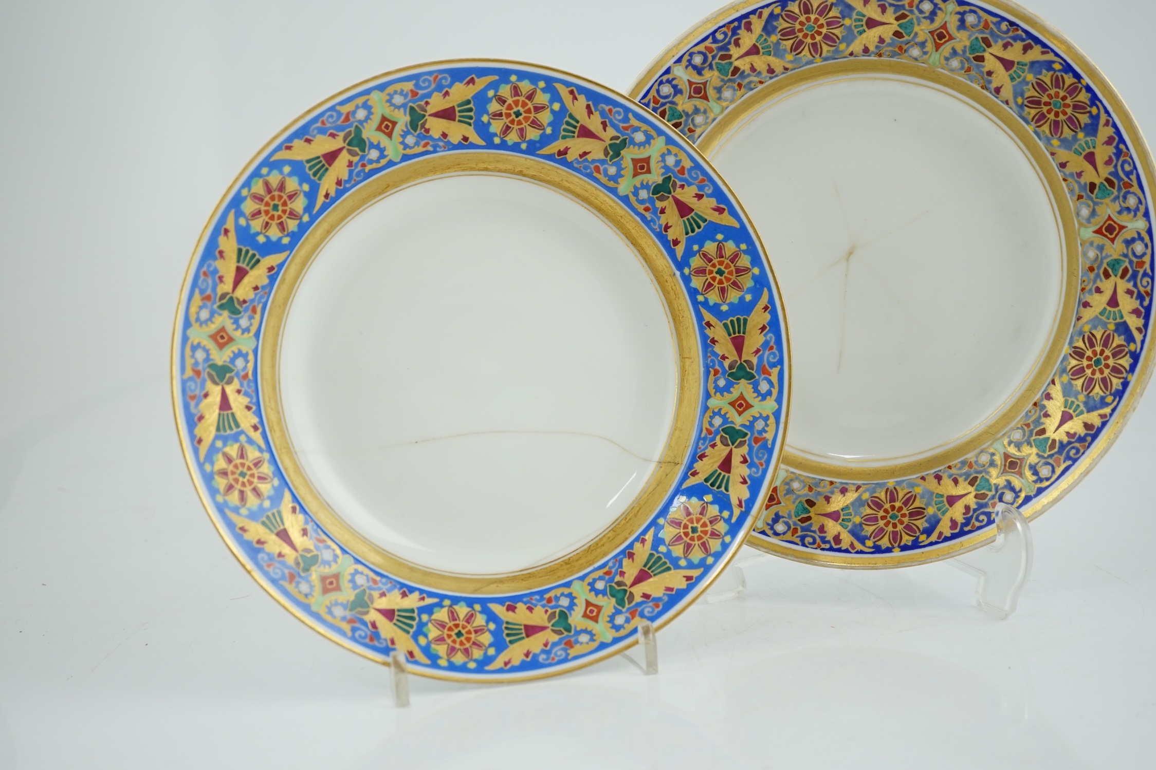 A pair of Nicholas II Imperial porcelain factory plates, from the Gothic service, green printed marks, 23.5cm diameter. Condition - poor to fair repairs